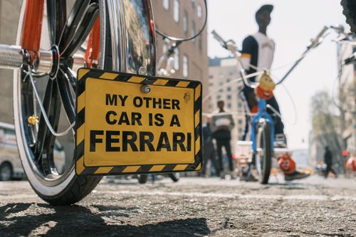 Free Close-up of a humorous license plate on a bicycle in Johannesburg's urban street scene. Stock Photo