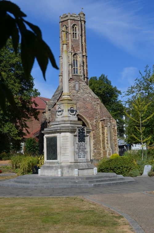 Free Historic church ruins and war memorial in a serene garden setting. Stock Photo