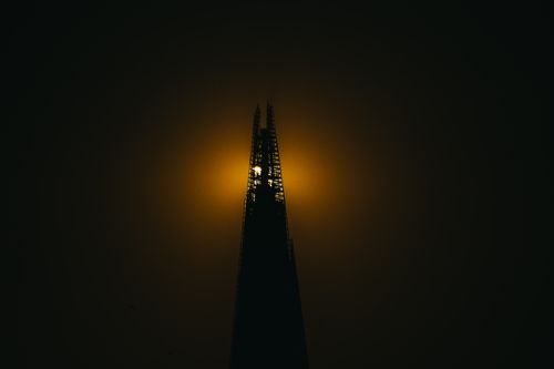 Free The Shard's silhouette with a dramatic sunset backdrop creating a striking visual. Stock Photo