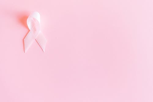 Free Pink Ribbon on Pink Surface Stock Photo