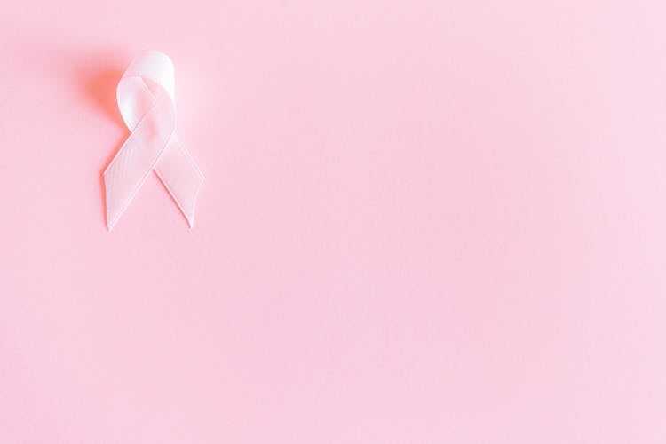 Pink Ribbon On Pink Surface