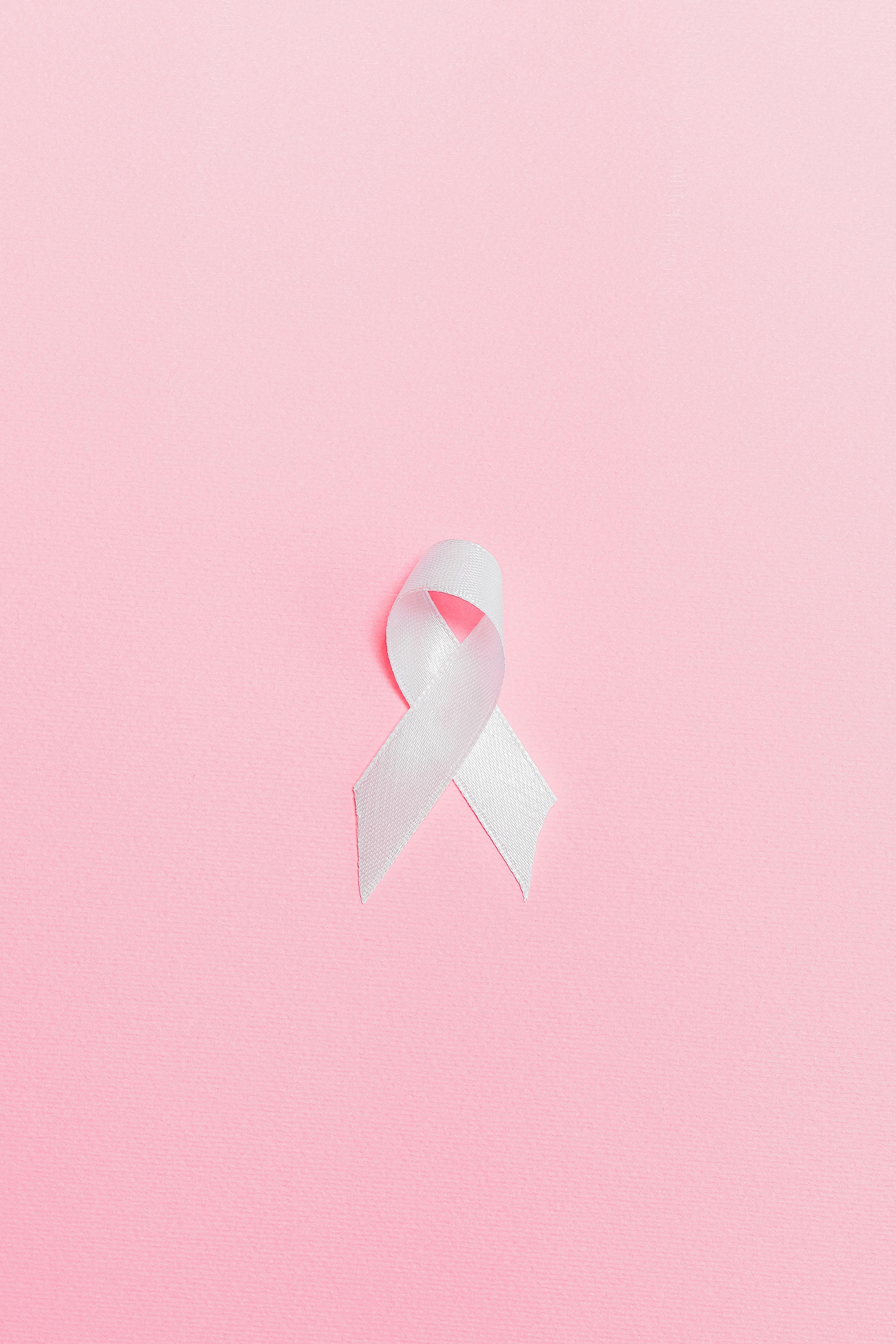 Pink Ribbon on Pink Surface · Free Stock Photo