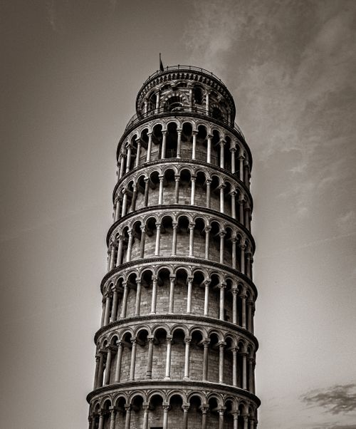 Free A striking sepia photograph of the Leaning Tower of Pisa, capturing its iconic tilt. Stock Photo