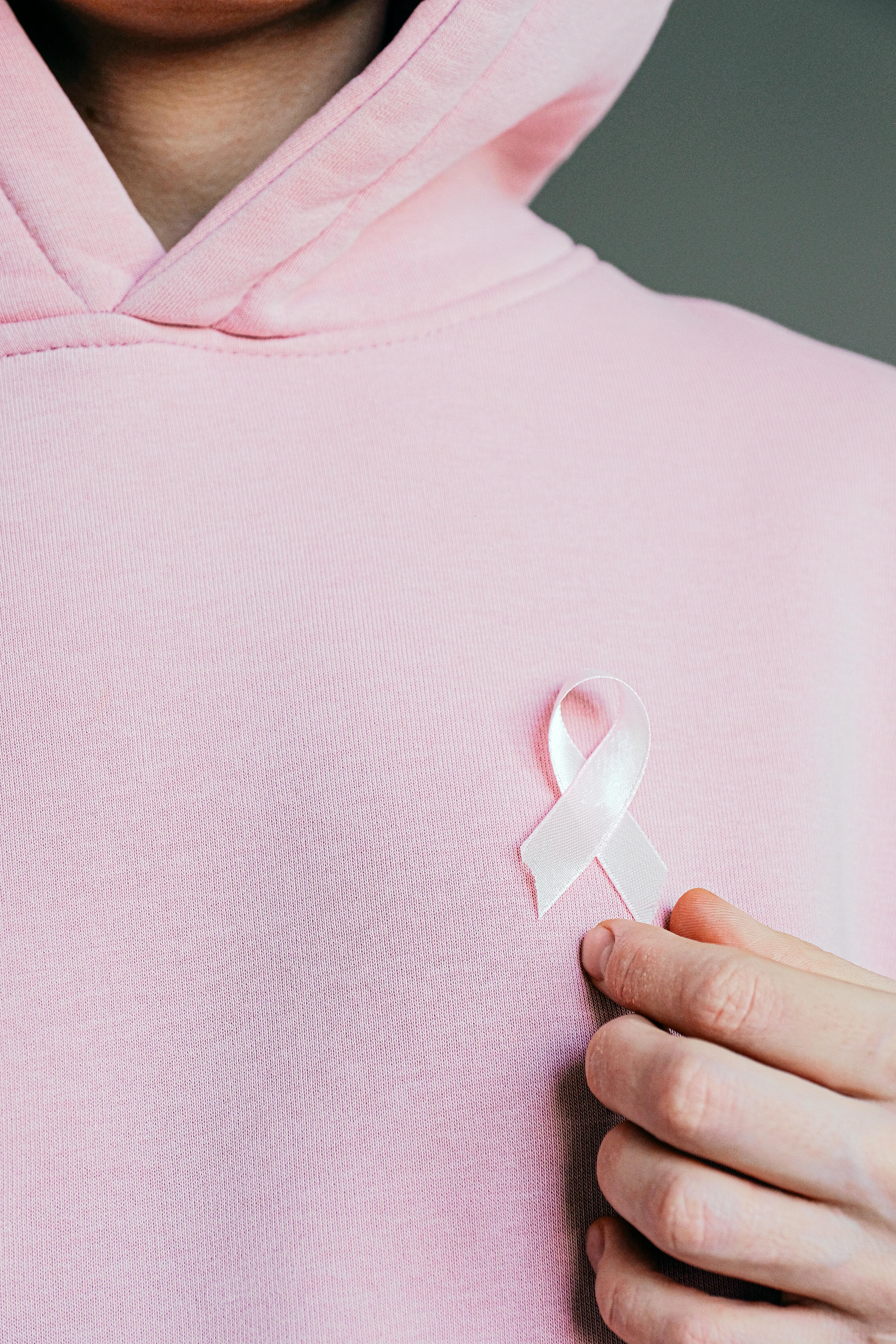 woman wearing pink ribbon