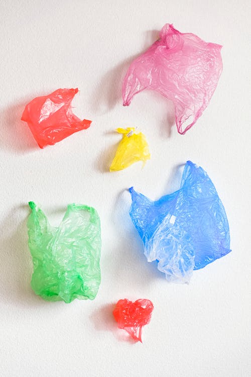 Free Multicolor Plastic Bags on the Floor Stock Photo