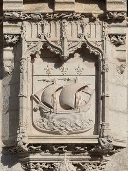 Exquisite stone carving of a ship in La Rochelle, France, showcasing Gothic architecture.