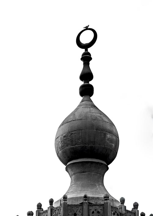 Free Close-up of a detailed architectural finial with a clear sky background. Stock Photo