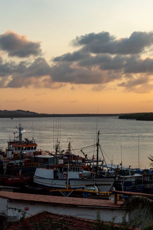 Free Serene view of fishing boats docked at sunset in Rio Grande do Norte, Brazil. Stock Photo