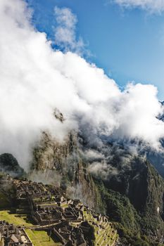 Stunning aerial view of Machu Picchu amidst clouds in Cuzco, Peru.