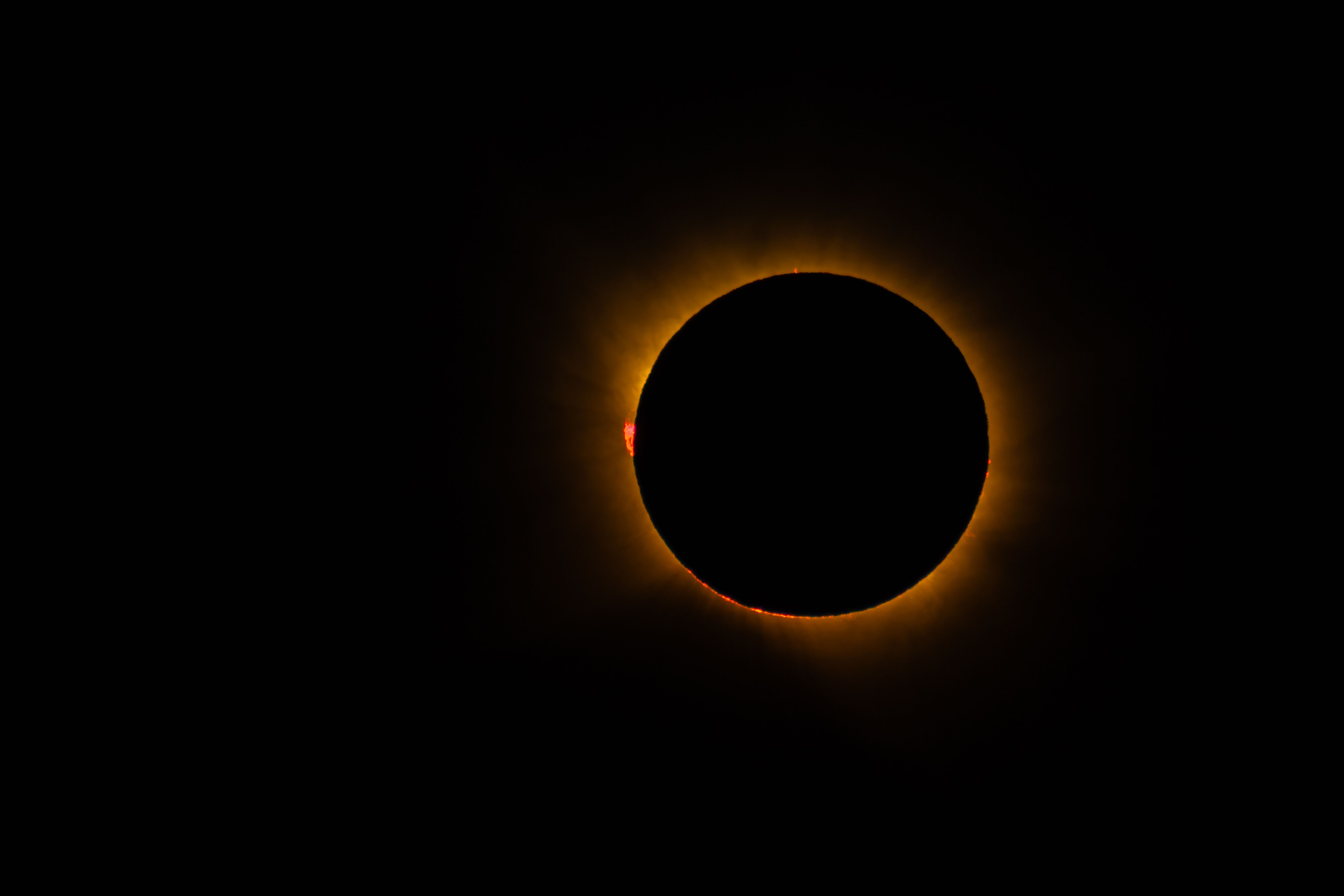 Millions across Spain and Portugal watch the start of the countries' first total solar eclipse in over a century news update image