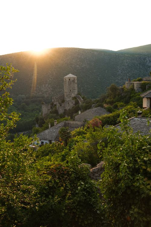 Free Captivating sunset over Počitelj Castle, showcasing natural beauty and historical charm. Stock Photo