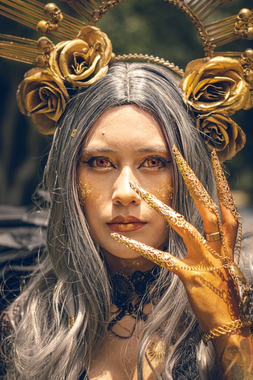 Free Striking portrait of a gothic cosplayer with artistic makeup and golden accessories in Ciudad de México. Stock Photo