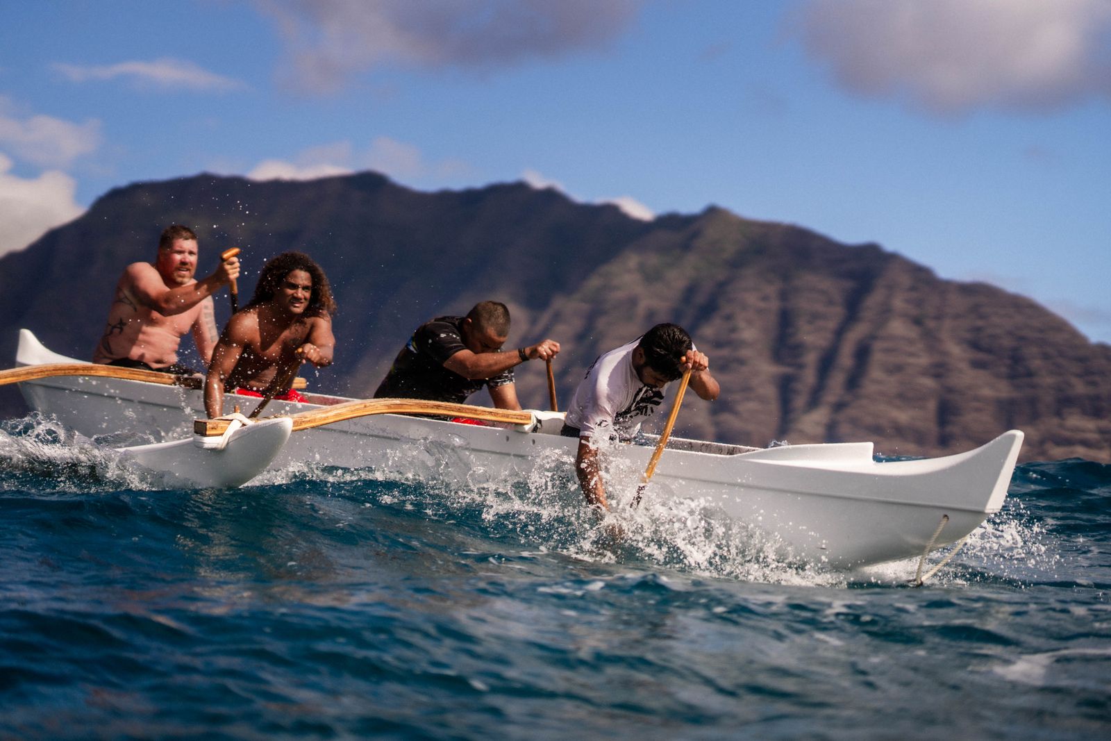Paddling an outrigger canoe in Hawaiian waters