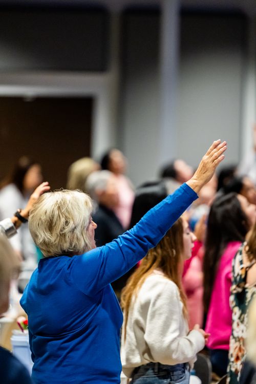 Free A diverse group of people actively participating at a live conference or seminar. Stock Photo
