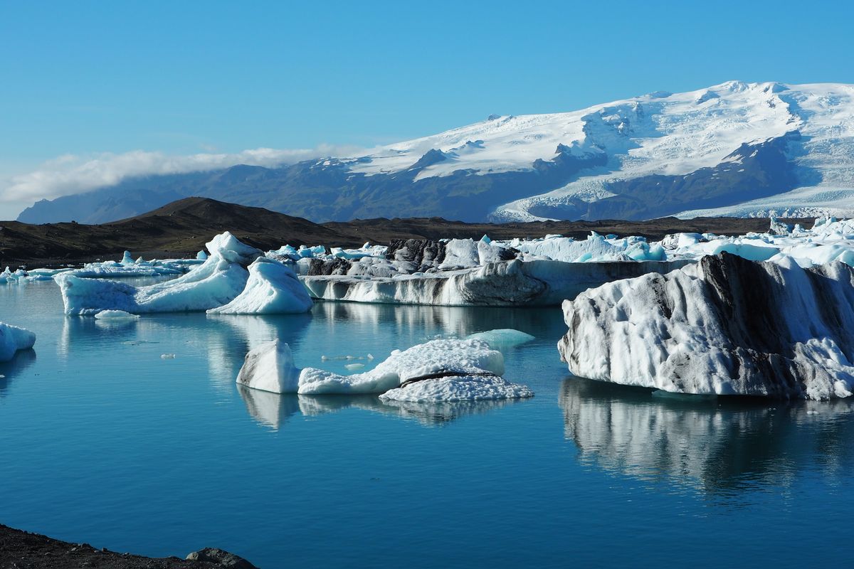 Icebergs mirrored in the glacier lagoon