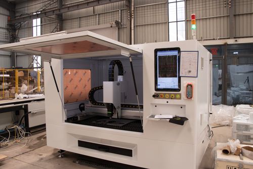 Free High-tech CNC machine shown in an industrial factory environment, ready for operation. Stock Photo