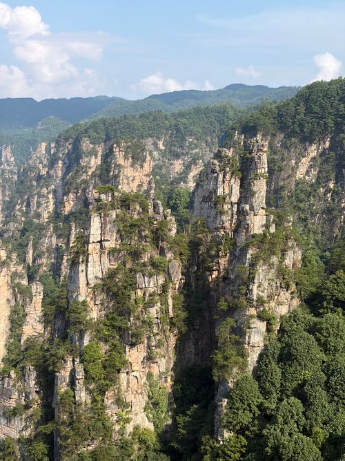 Free Explore the stunning sandstone pillars of Zhangjiajie National Forest Park in Hunan, China, captured on a sunny day. Stock Photo
