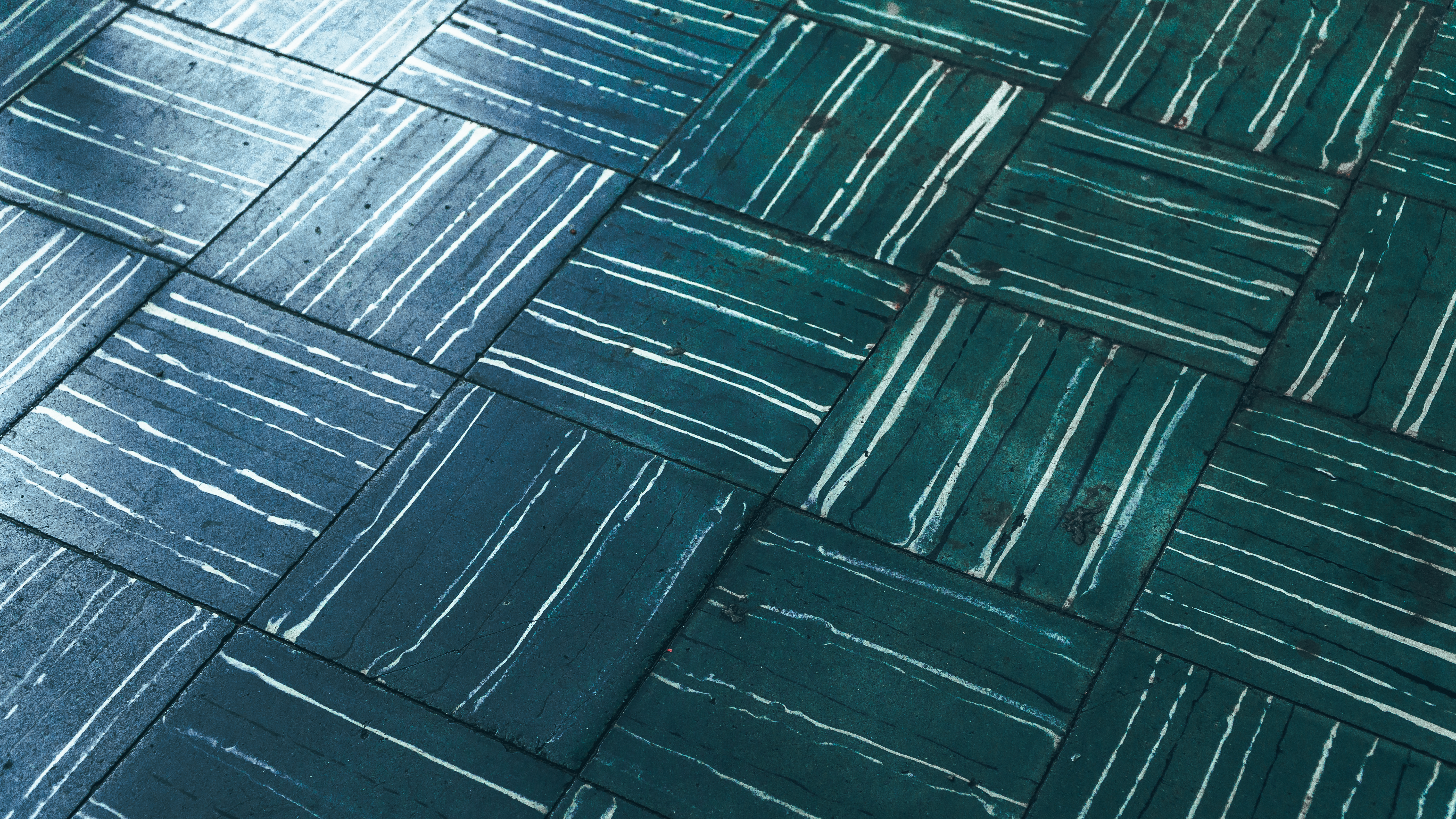 Close-up of blue tiles with intricate white line designs. Ideal for backgrounds.