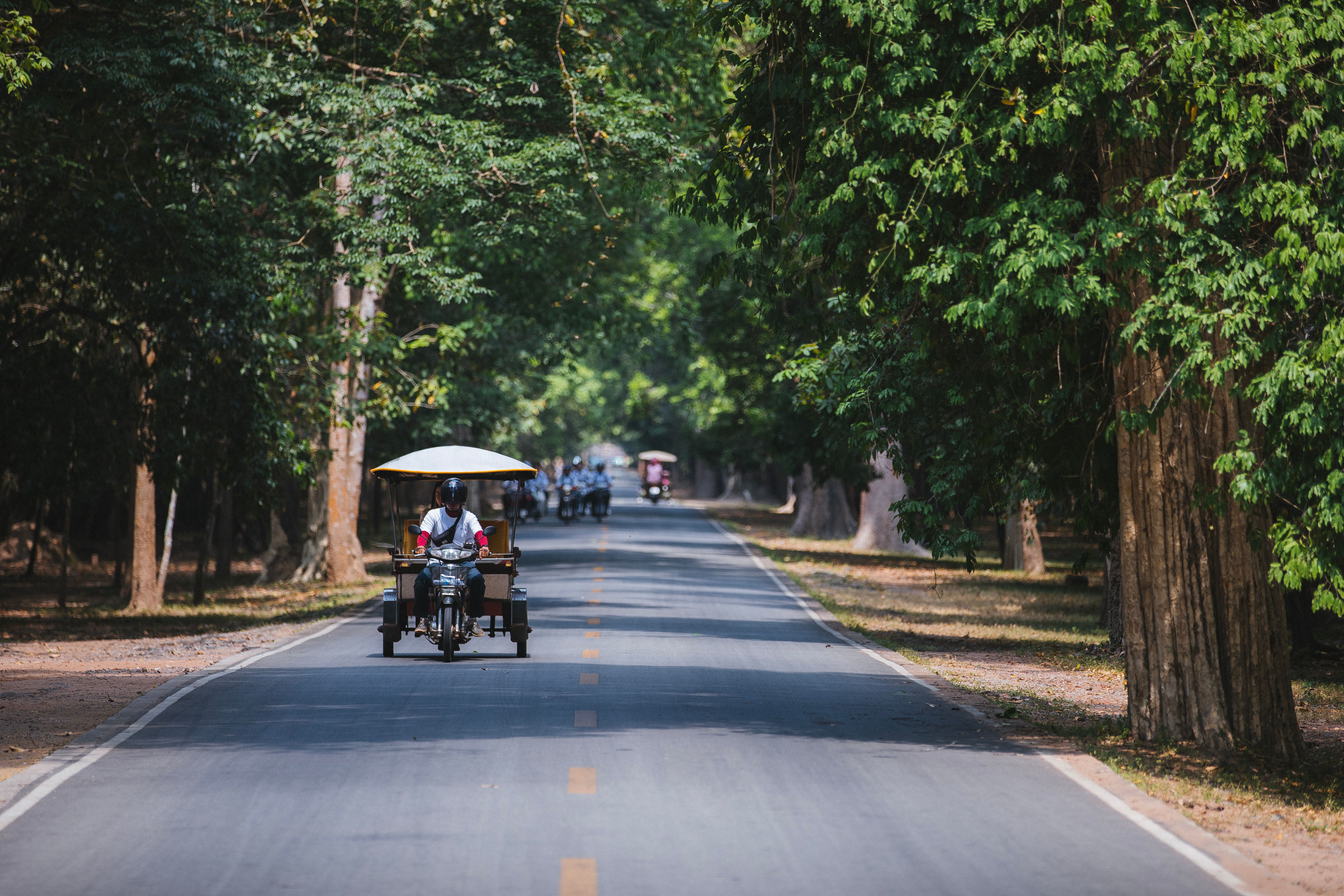 A traditional tuk-tuk on a street in Siem Reap, Cambodia