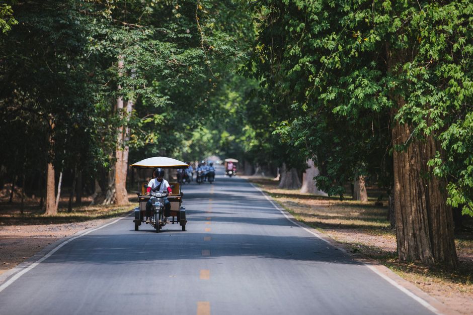 A traditional tuk-tuk on a street in Siem Reap, Cambodia