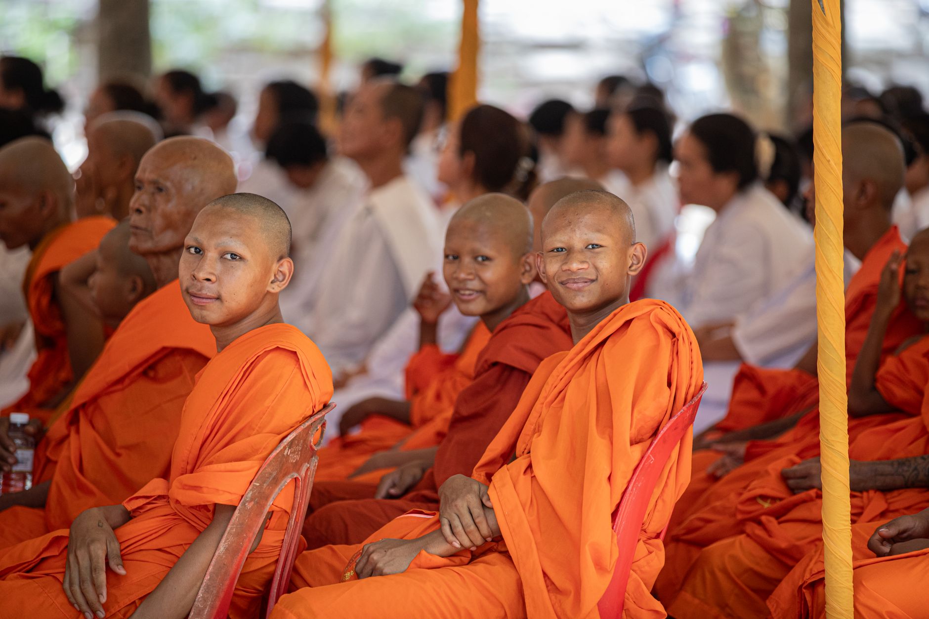 Young Buddhist novices smile during a monastic gathering in Siem Reap, Cambodia.