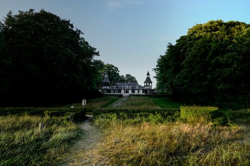 Free Charming manor surrounded by lush greenery and manicured gardens in daytime. Stock Photo