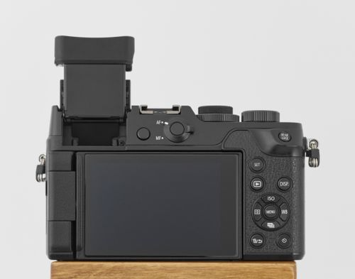 Free Rear view of a digital camera showing the screen and control buttons on white background. Stock Photo