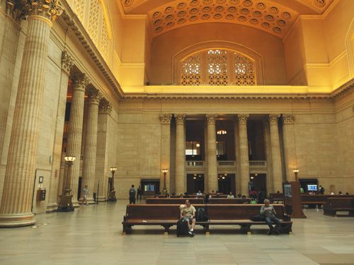 Free Historic large hall of Chicago Union Station featuring grand columns and benches. Stock Photo