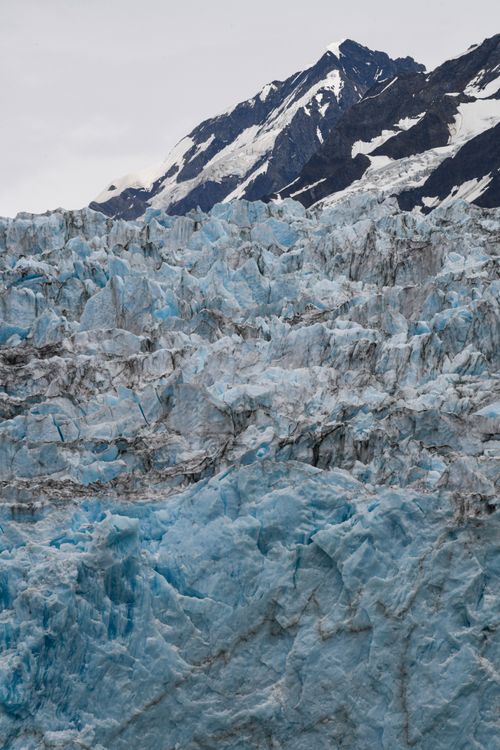 Free Stunning view of the icy blue formations of Yale Glacier in Alaska with rugged mountain backdrop. Stock Photo
