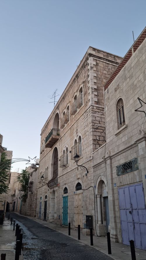 Free Charming view of historic stone architecture in a narrow alley during daytime, offering a sense of ancient urban charm. Stock Photo