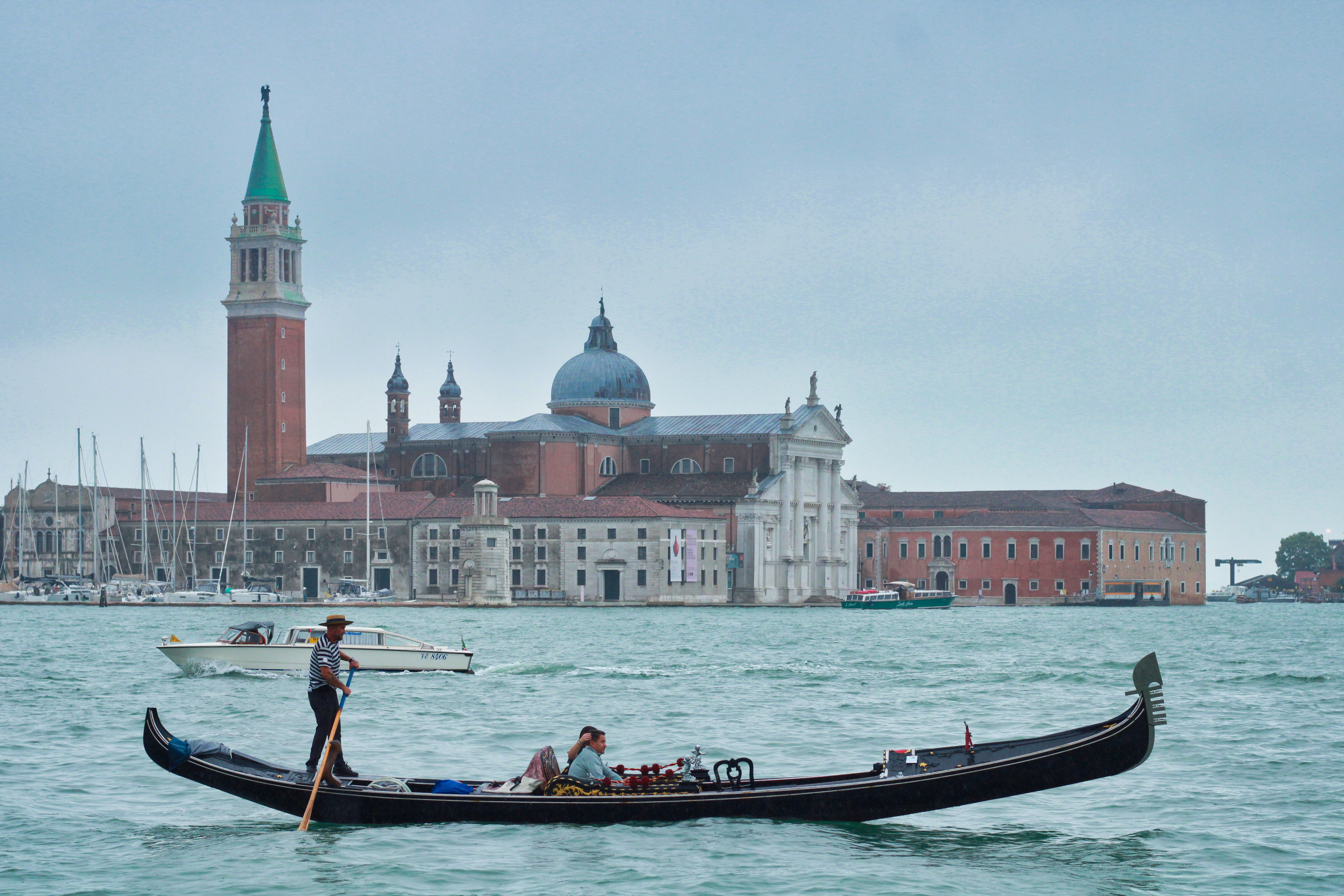 Gondola gliding on Venetian waters with San Giorgio Maggiore in the background.
