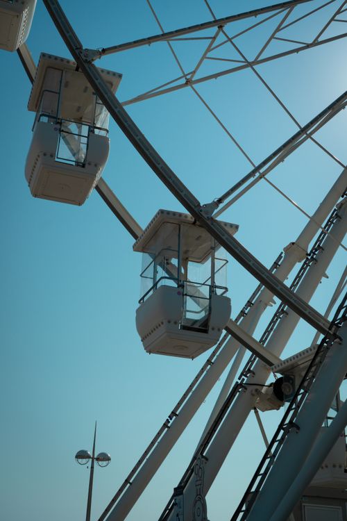 Free Detail of a Ferris wheel under a bright blue sky in Saint-Jean-de-Monts, France. Stock Photo