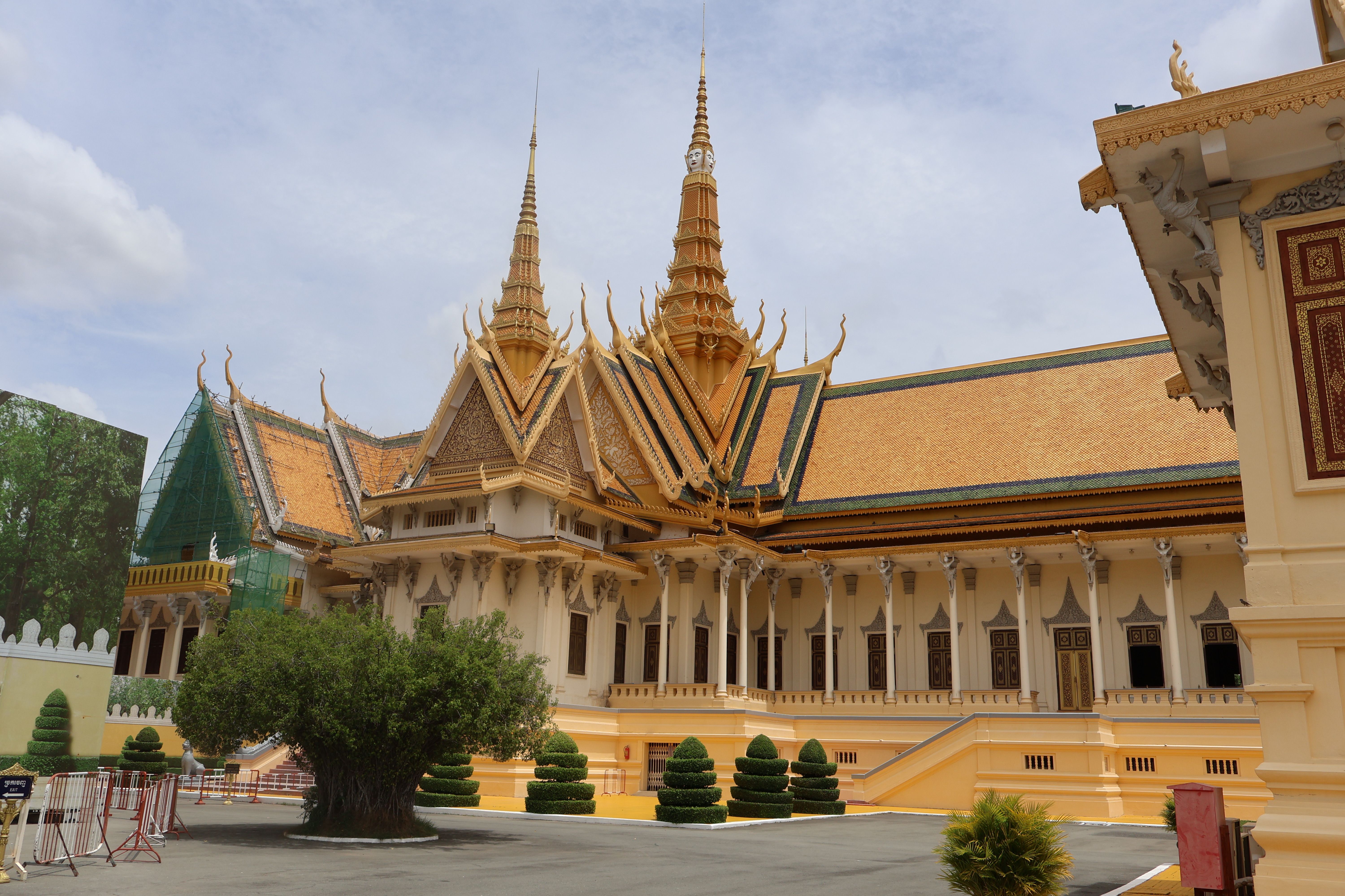 Arrival hall at Phnom Penh International Airport with mobile operator kiosks in Cambodia