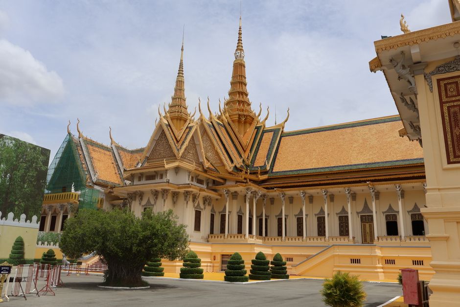 Arrival hall at Phnom Penh International Airport with mobile operator kiosks in Cambodia