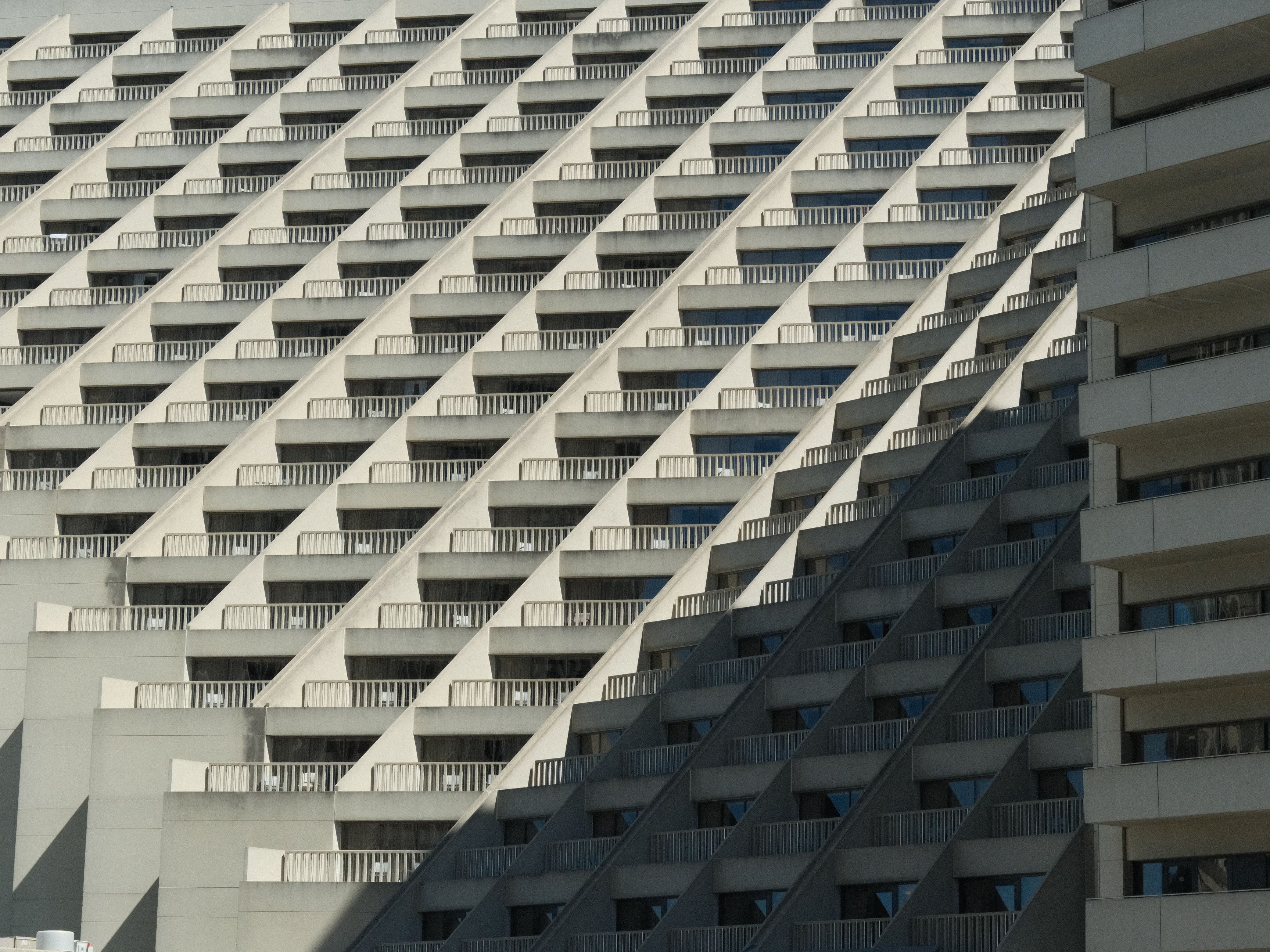 A striking view of geometric designs on a modern building facade, capturing urban architecture's elegance.