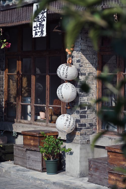 Free Traditional Asian tea house with paper lanterns and rustic charm. Stock Photo
