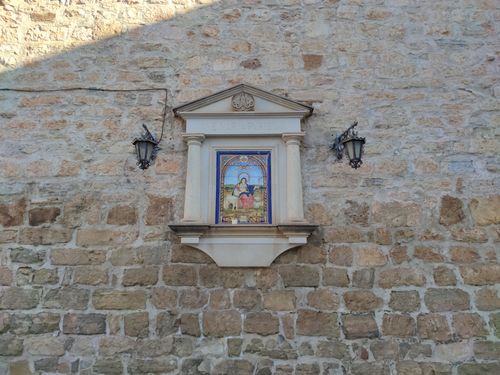 Free A decorative religious tile set in a historic stone wall in Jaén, Andalucía. Stock Photo