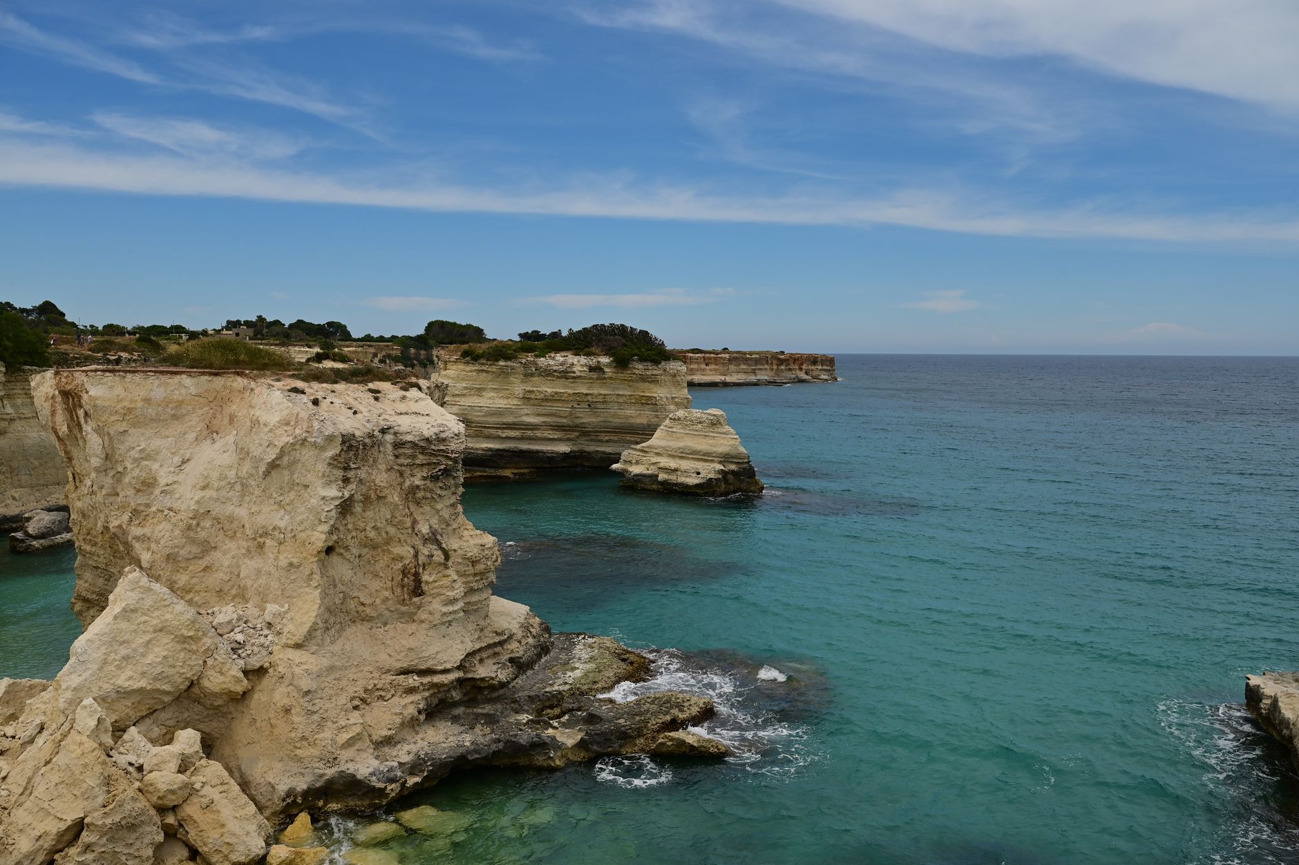 Breathtaking cliffside landscape overlooking turquoise waters in Otranto, Italy
