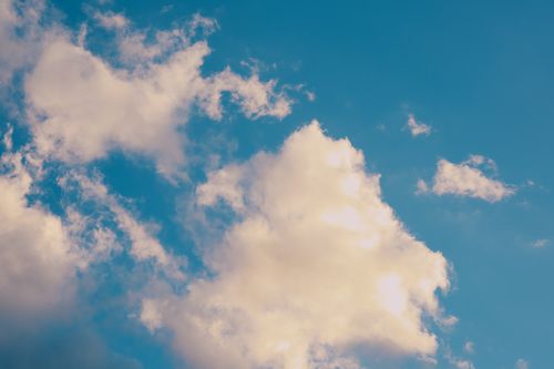 Free A captivating view of fluffy white clouds against a bright blue sky, showcasing the beauty of nature. Stock Photo