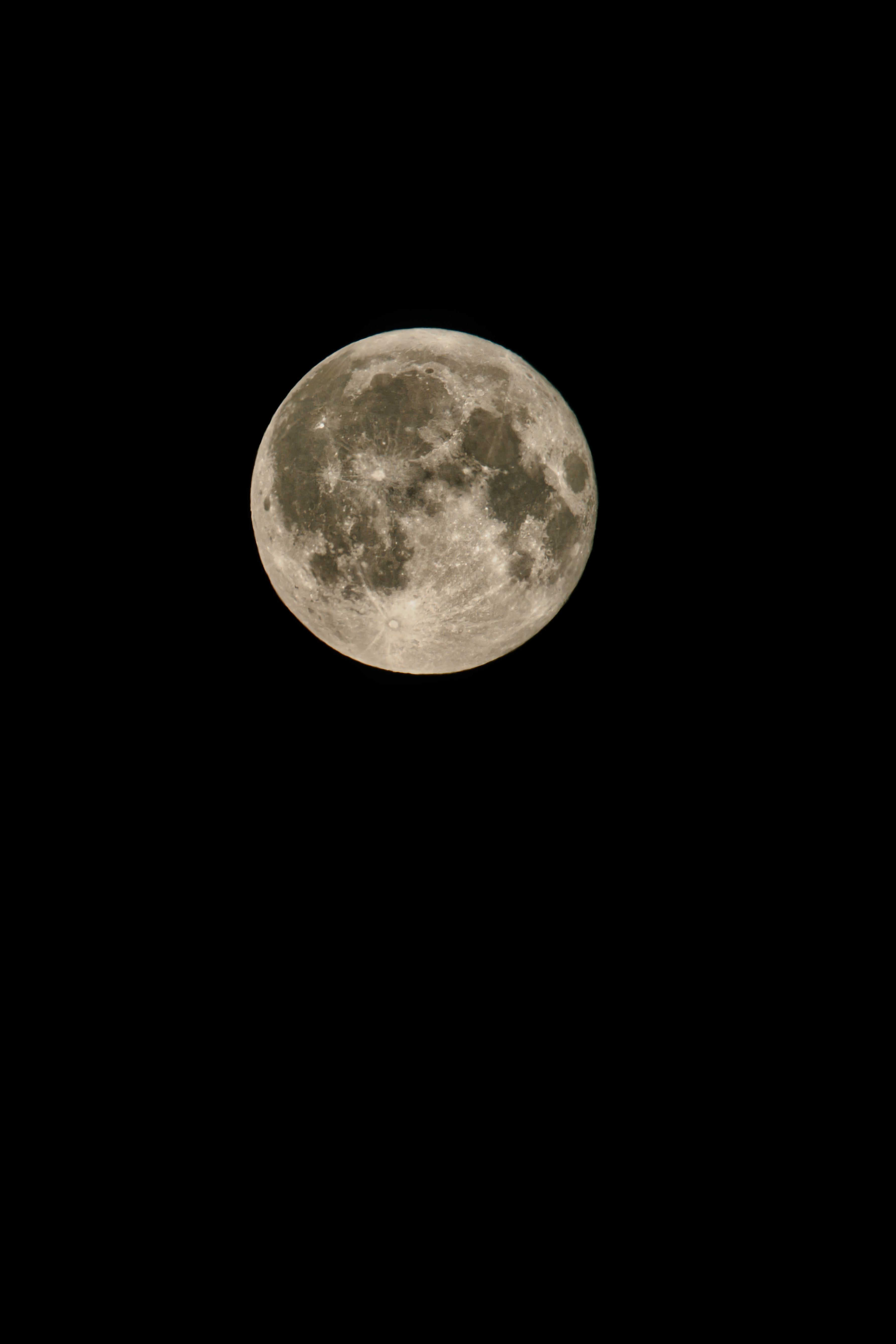 A vivid full moon captured in the night sky over Oranienburg, Brandenburg, displaying craters and surface details.