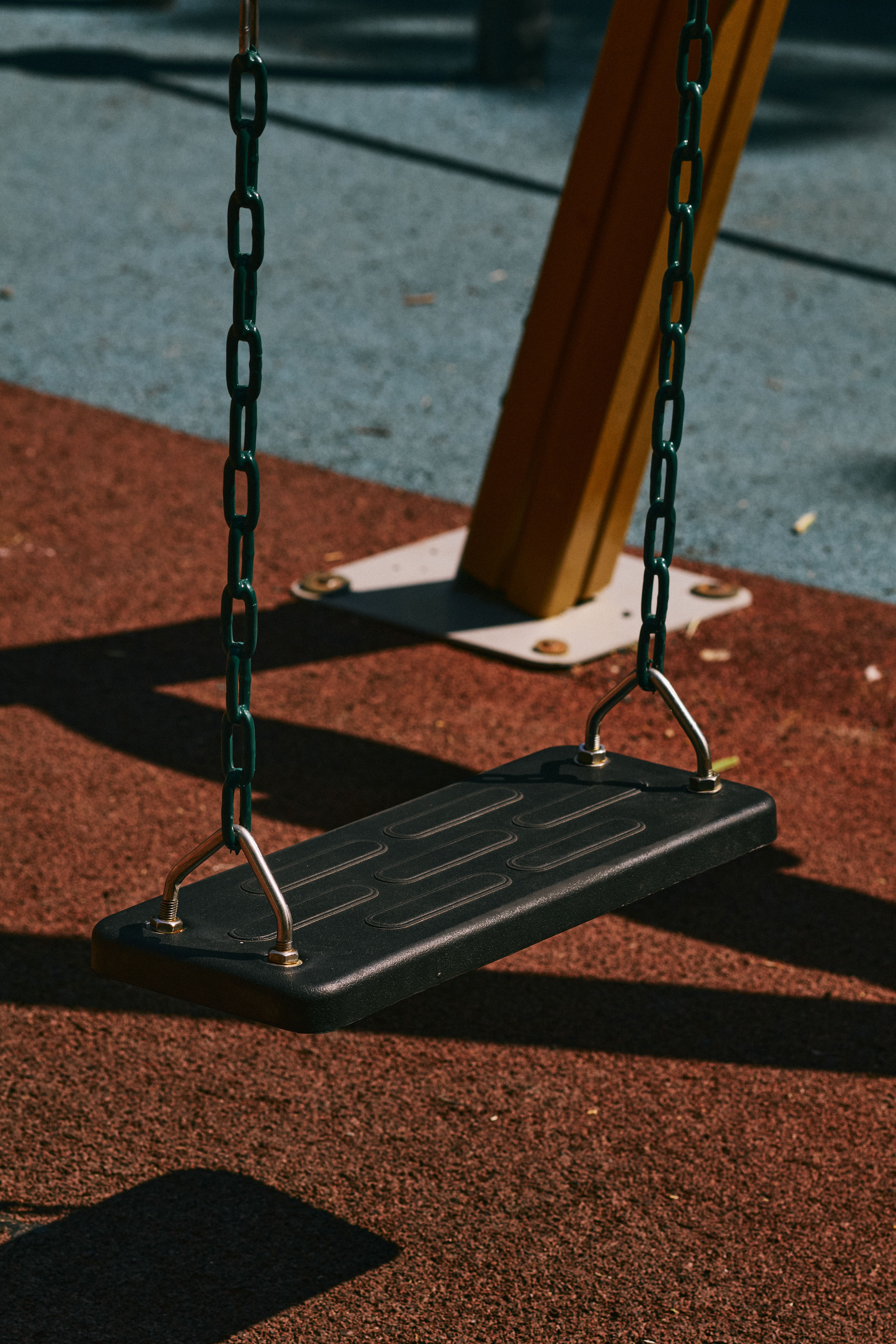 an empty playground swing