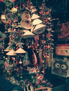 Photo by Lee Dat Vibrant display of traditional handicrafts and hats in a bustling market setting, showcasing rich cultural diversity.