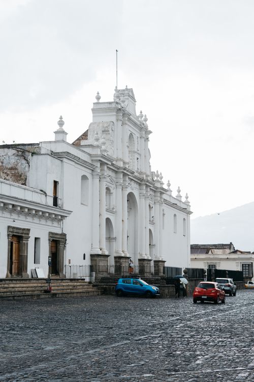 Free Explore the timeless beauty of Antigua's historic cathedral under a cloudy sky. Stock Photo