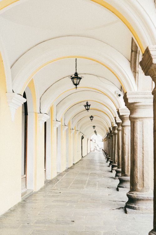 Free Beautifully arched colonial architecture in Antigua, Guatemala's historic city center. Stock Photo