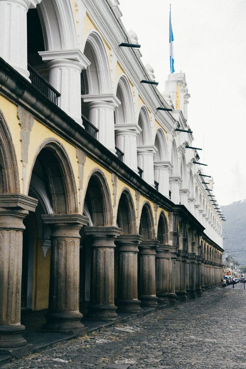 Free Explore the historic arches and columns of Antigua Guatemala's Palacio de los Capitanes Generales. Stock Photo