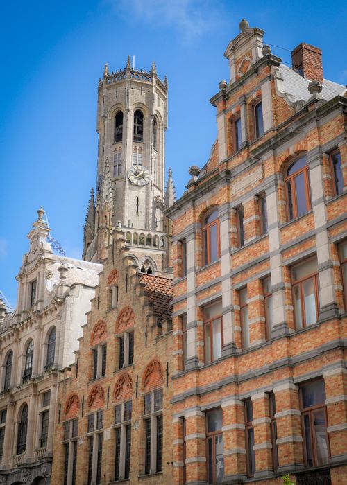 Free Historic Belfry and medieval buildings in Bruges, Belgium showcase Gothic architecture. Stock Photo