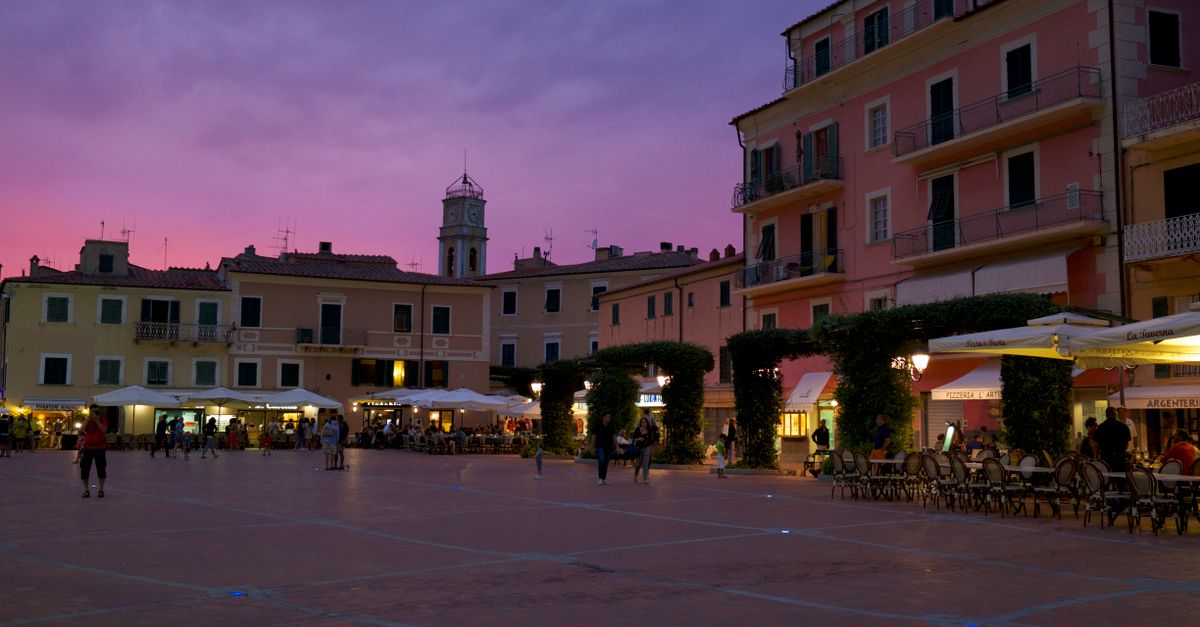 A quiet Italian street lit at dusk, reflecting the country’s discreet nightlife culture