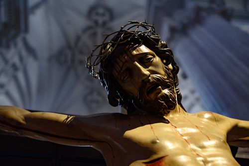 Free Detailed close-up of a crucifixion sculpture with crown of thorns inside Granada Cathedral. Stock Photo