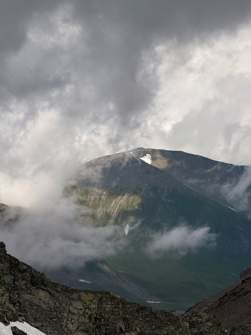 Free Dramatic cloud cover over the scenic Caucasus Mountains captured in summer. Stock Photo