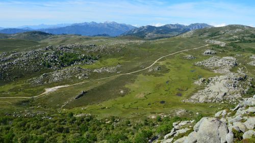 Free A serene aerial view of Aullène's rocky mountains and lush greenery in Corsica, France. Stock Photo